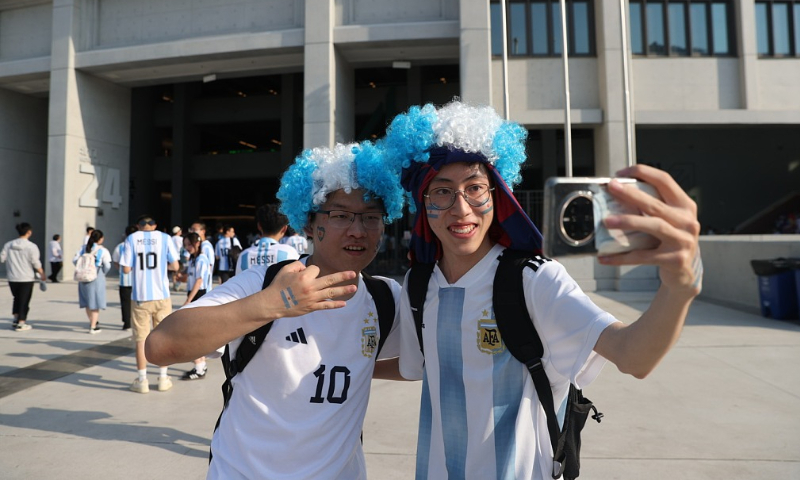 Fans are taking photos outside the Beijing Workers' Stadium before a friendly match between Argentina and Australia on June 15, 2023. Photo: VCG