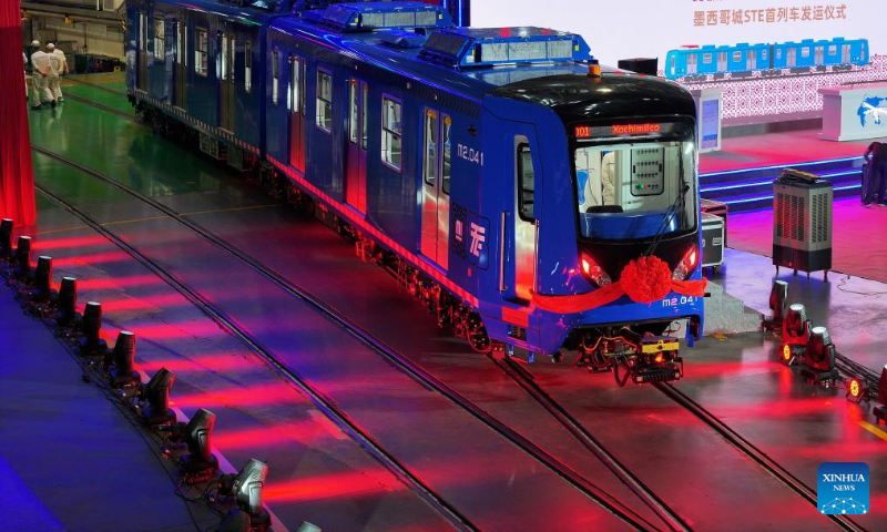 This aerial photo taken on Sept. 10, 2023 shows the exterior view of the first articulated light rail train customized by CRRC Zhuzhou Locomotive Co., Ltd., for Mexico City, in Zhuzhou, central China's Hunan Province. The first articulated light rail train customized by CRRC Zhuzhou Locomotive Co., Ltd. for Mexico City has rolled off the assembly line on Saturday. (Xinhua/Chen Zeguo)