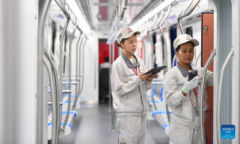 Workers inspect the first articulated light rail train customized by CRRC Zhuzhou Locomotive Co., Ltd. for Mexico City, in Zhuzhou, central China's Hunan Province, Sept. 9, 2023.
The first articulated light rail train customized by CRRC Zhuzhou Locomotive Co., Ltd. for Mexico City has rolled off the assembly line on Saturday. (Xinhua/Chen Zeguo)