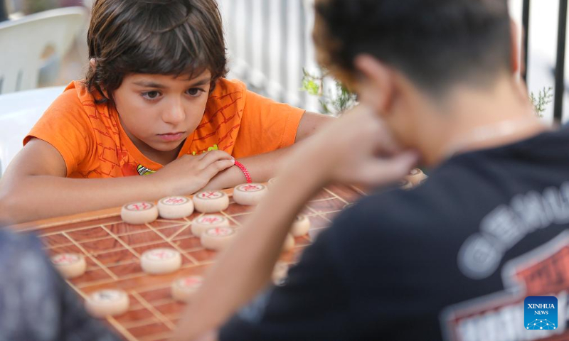 Young participants compete during the Lebanese-Chinese XiangQi Friendship Championship in Deir el Qamar, Mount Lebanon Governorate, Lebanon, on Sept. 10, 2023. (Xinhua/Bilal Jawich)