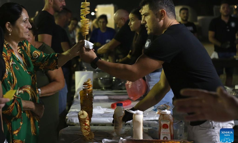 People attend an international potato festival in the village of Xylofagou, Cyprus, on Sept. 7, 2023. An international potato festival kicked off on Thursday in the village of Xylofagou, which is renowned for its potato production.(Photo: Xinhua)
