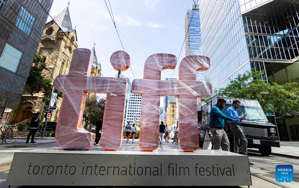 People walk past a Toronto International Film Festival (TIFF) sign in Toronto, Canada, on Sept. 7, 2023. The TIFF kicked off here on Thursday.(Photo: Xinhua)