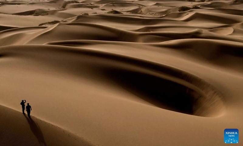 This aerial photo taken on Sept. 7, 2023 shows the scenery of a desert scenic spot in Makit County of Kashgar, northwest China's Xinjiang Uygur Autonomous Region. Makit County, located on the southwestern rim of the Taklimakan Desert, has taken advantage of its natural resources to develop tourism and provide jobs for the local people. Photo: Xinhua