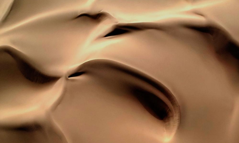 This aerial photo taken on Sept. 7, 2023 shows the scenery of a desert scenic spot in Makit County of Kashgar, northwest China's Xinjiang Uygur Autonomous Region. Makit County, located on the southwestern rim of the Taklimakan Desert, has taken advantage of its natural resources to develop tourism and provide jobs for the local people. Photo: Xinhua