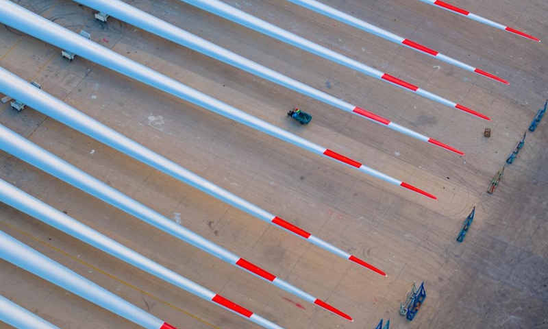 This aerial photo taken on Sept. 7, 2023 shows wind turbine blades at a port in Yancheng, east China's Jiangsu Province. Yancheng has boosted green and low-carbon development by advancing new energy industries such as wind and photovoltaic power in recent years. Photo: Xinhua