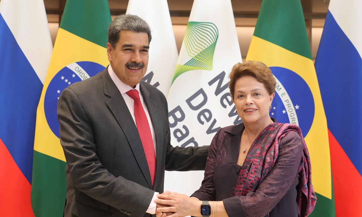 Venezuelan President Nicolas Maduro (left) greets President of the BRICS New Development Bank and former President of Brazil, Dilma Rousseff, during his visit to the NDB headquarters in Shanghai, China on September 10, 2023. Maduro emphasized that BRICS and the bank have