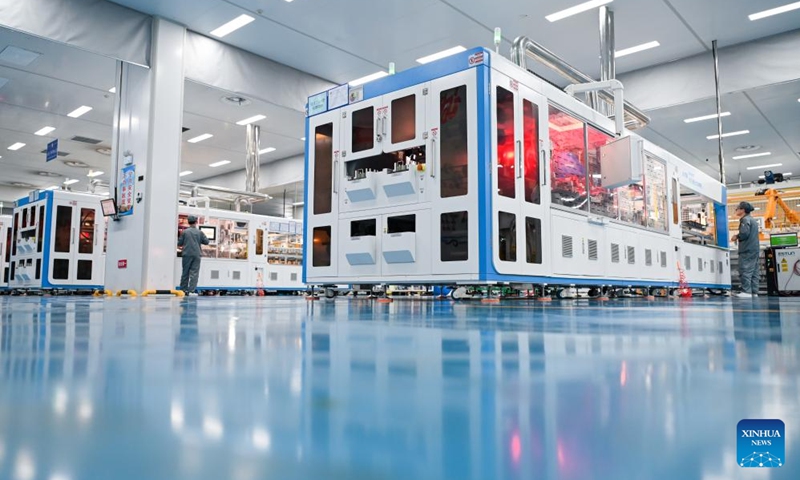 Staff members work at a workshop of a photovoltaic technology company in Yancheng, east China's Jiangsu Province, Sept. 6, 2023. Yancheng has boosted green and low-carbon development by advancing new energy industries such as wind and photovoltaic power in recent years. Photo: Xinhua