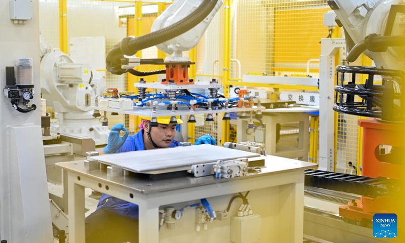 A staff member inspects an intelligent robot at a workshop of WeView Technology in Yancheng, east China's Jiangsu Province, Sept. 8, 2023. Yancheng has boosted green and low-carbon development by advancing new energy industries such as wind and photovoltaic power in recent years. Photo: Xinhua