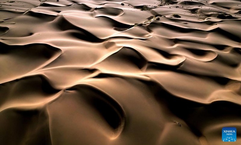 This aerial photo taken on Sept. 7, 2023 shows the scenery of a desert scenic spot in Makit County of Kashgar, northwest China's Xinjiang Uygur Autonomous Region. Makit County, located on the southwestern rim of the Taklimakan Desert, has taken advantage of its natural resources to develop tourism and provide jobs for the local people. Photo: Xinhua