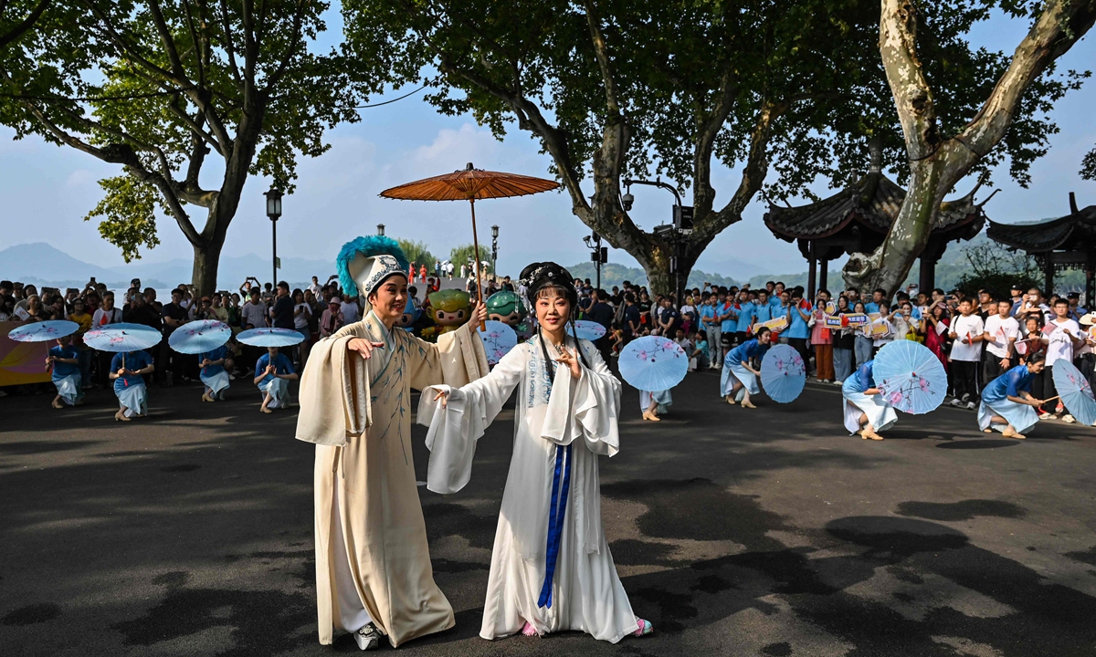 Performers take part in a performance before the start of the Asian Games torch relay in Hangzhou, Zhejiang Province on September 8, 2023. Photo: VCG