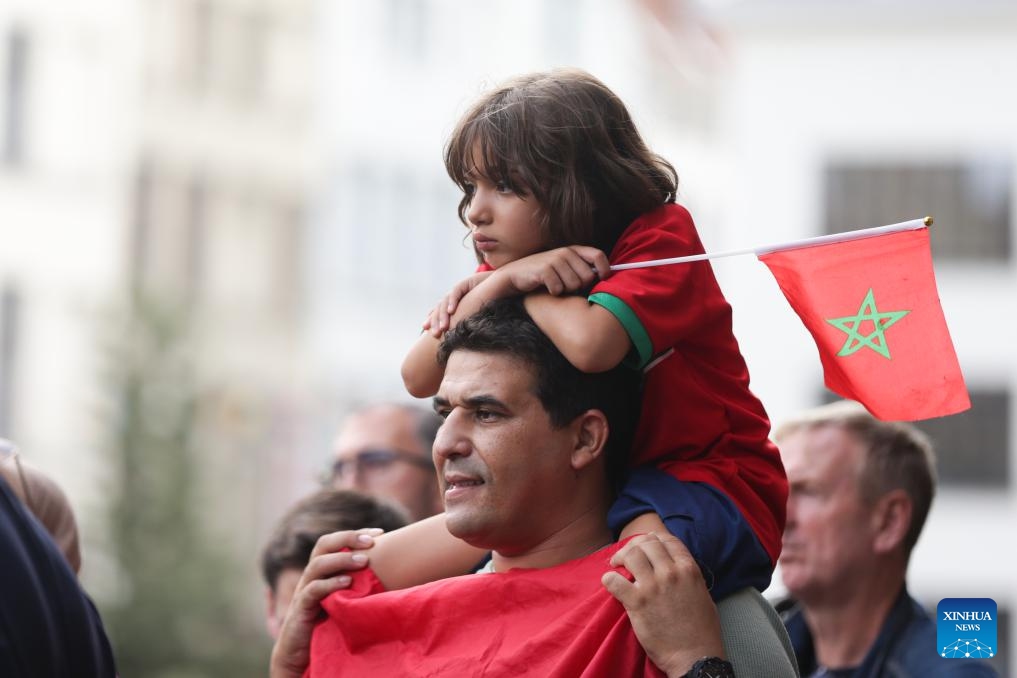 People with flags of Morocco attend a memorial service for victims of the earthquake in Morocco, in central Antwerp, Belgium, on Sept. 11, 2023.(Photo: Xinhua)