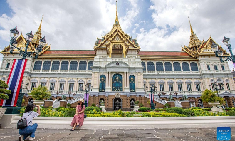 Tourists take photos at the Grand Palace scenic spot in Bangkok, Thailand, June 15, 2023. Thailand has approved a temporary visa waiver for visitors from China and Kazakhstan during the year-end high season in support of its vital tourism industry.(Photo: Xinhua)
