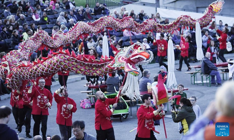 People perform dragon dance during a celebration to mark the upcoming Chinese Mid-Autumn Festival at the Gardens of the World in Berlin, Germany, Sept. 23, 2023. (Xinhua/Ren Pengfei)