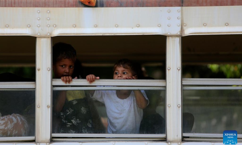 Displaced Palestinian children wait to move from a shelter in Sidon to a center of the United Nations Relief and Works Agency for Palestine Refugees (UNRWA) in Mount Lebanon Governorate, Lebaon, Sept. 12, 2023. The latest round of armed clashes between members of the Fatah Movement and Islamic militants in the Ain Al-Helweh Palestinian refugee camp broke out last Thursday evening and intensified in the following days.(Photo: Xinhua)