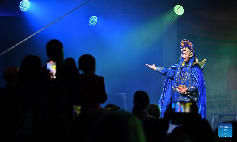 An actor performs during a celebration to mark the upcoming Chinese Mid-Autumn Festival at the Gardens of the World in Berlin, Germany, Sept. 23, 2023. (Xinhua/Ren Pengfei)