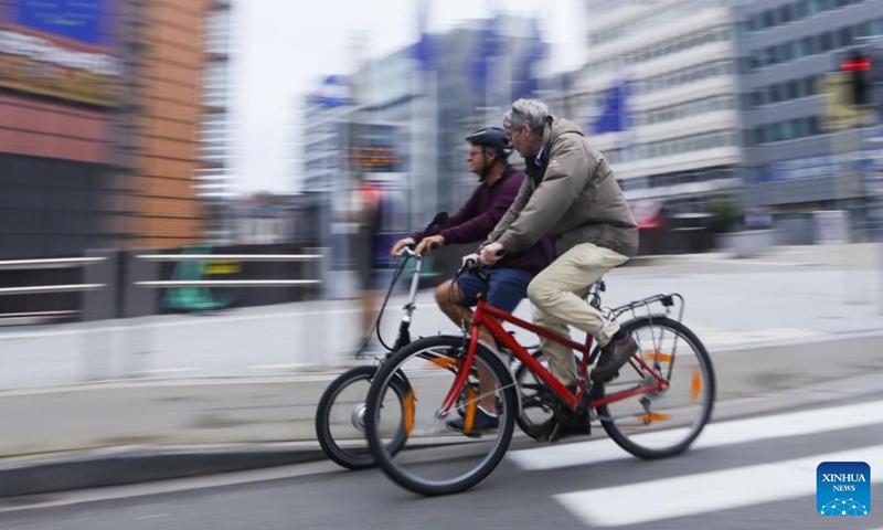 People ride bikes on Car Free Sunday in Brussels, Belgium, Sept. 17, 2023. The annual Car Free Sunday event was held in the Belgian capital on Sunday, offering the public an opportunity to rediscover the city using alternative means of transport. During the day, the whole Brussels Region is closed to traffic from 9:30 a.m. till 7 p.m., with the exception of public transport, taxis, emergency, police and persons with a special permit. (Xinhua/Zheng Huansong)