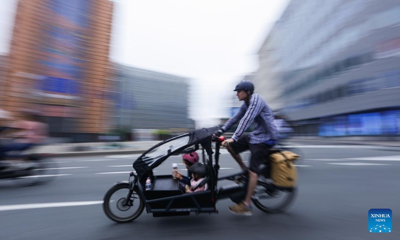 A man rides bike on Car Free Sunday in Brussels, Belgium, Sept. 17, 2023. The annual Car Free Sunday event was held in the Belgian capital on Sunday, offering the public an opportunity to rediscover the city using alternative means of transport. During the day, the whole Brussels Region is closed to traffic from 9:30 a.m. till 7 p.m., with the exception of public transport, taxis, emergency, police and persons with a special permit. (Xinhua/Zheng Huansong)