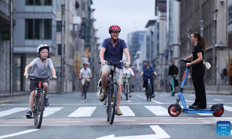 People ride bikes and scooters on Car Free Sunday in Brussels, Belgium, Sept. 17, 2023. The annual Car Free Sunday event was held in the Belgian capital on Sunday, offering the public an opportunity to rediscover the city using alternative means of transport. During the day, the whole Brussels Region is closed to traffic from 9:30 a.m. till 7 p.m., with the exception of public transport, taxis, emergency, police and persons with a special permit. (Xinhua/Zheng Huansong)