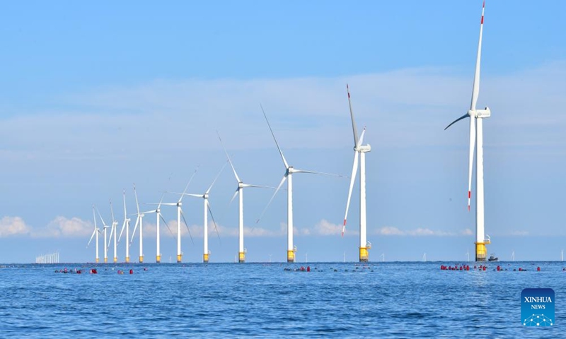 This photo taken on Sept. 13, 2023 shows an offshore wind farm in Dalian City of northeast China's Liaoning Province. In recent years, the three northeastern provinces of Liaoning, Jilin, and Heilongjiang have sped up the development of clean energy generation such as wind power, photovoltaic power and biomass power generation. This is of great significance for ensuring safe and reliable power supply, accelerating clean energy transition and low-carbon development, and promoting the full revitalization of northeast China. (Xinhua/Yang Qing)