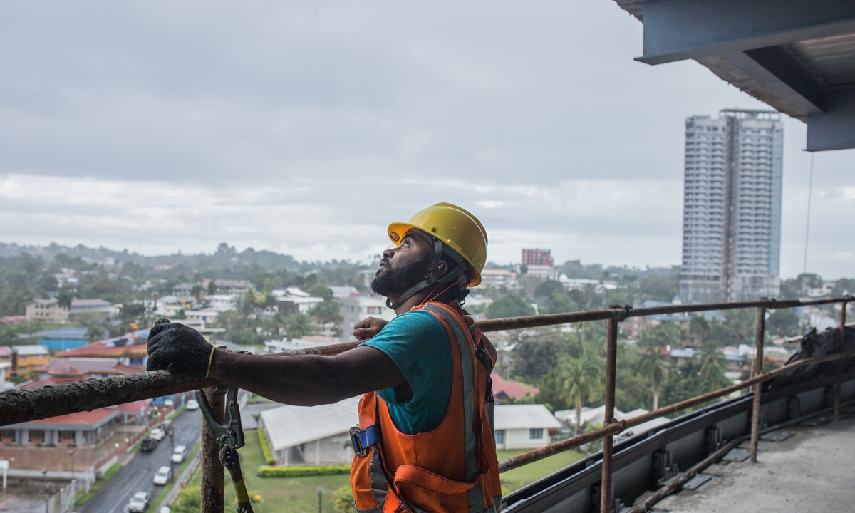 A local worker looks outside at the construction site of the FHL Commercial Tower in Suva, capital of Fiji on August 18. 2023. Photo: Shan Jie/GT