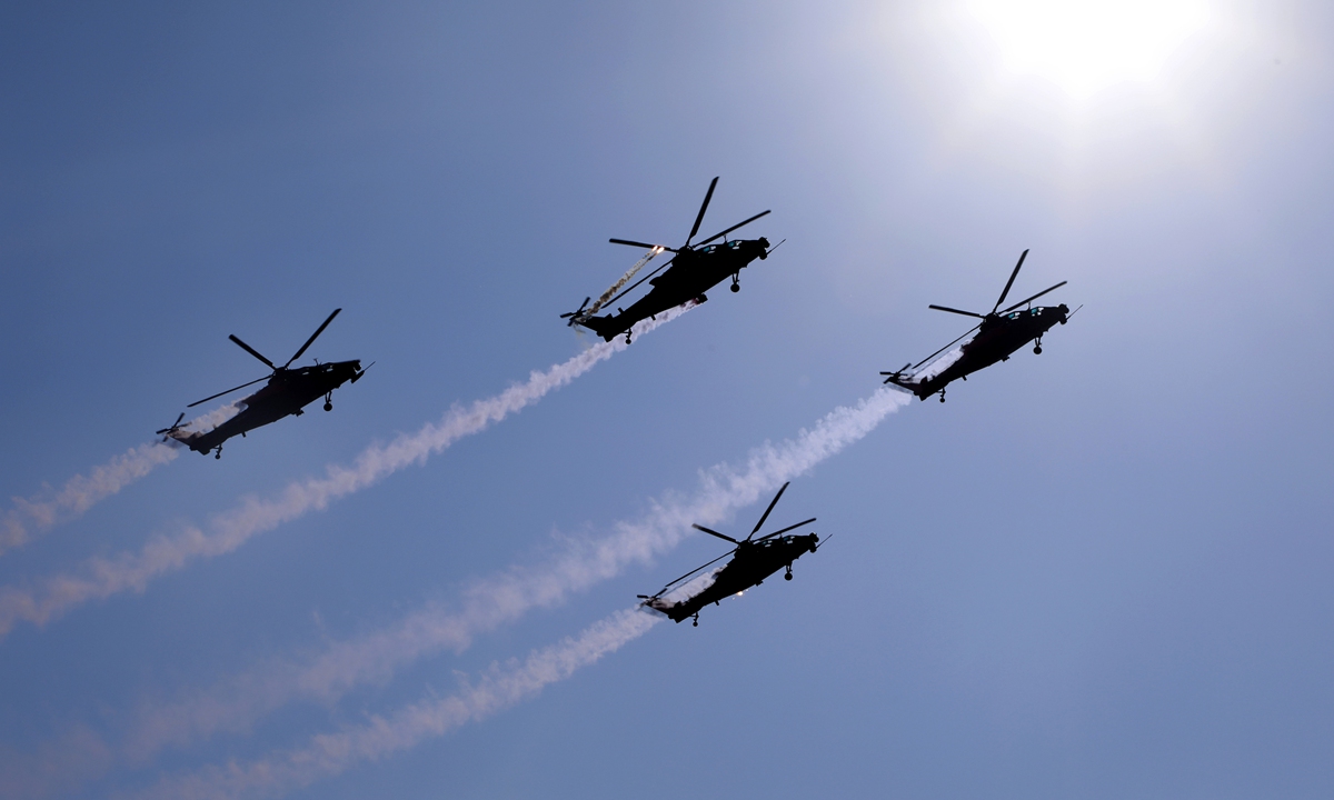A People's Liberation Army team puts on a performance in Z-10 attack helicopters during the 6th China Helicopter Exposition in north China's Tianjin Municipality, September 15, 2023. Photo: Xinhua