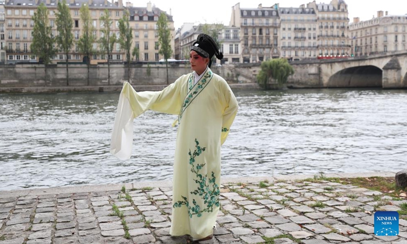 Kunqu Opera actor Shi Xiaming stages a flash mob performance along the River Seine in Paris, France, Sept. 13, 2023. Artists from east China's Jiangsu Province presented the charm of Kunqu Opera through a series of flash mob performances near the iconic landmarks in Paris. (Photo: Xinhua)
