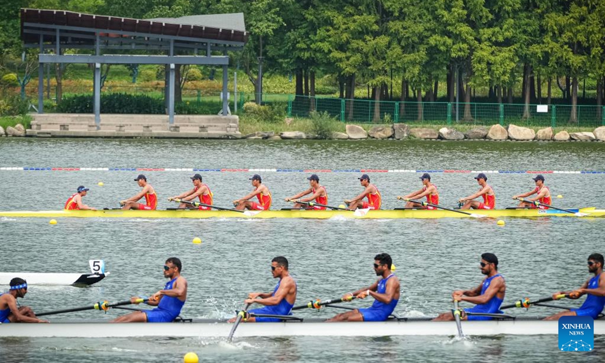 Team China (top) and team India compete during the Men's Eight Preliminary Race of rowing at the 19th Asian Games in Hangzhou, east China's Zhejiang Province, Sept. 20, 2023. (Xinhua/Jiang Han)







