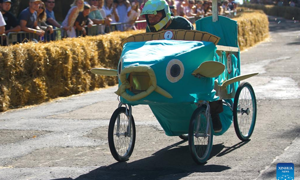 A competitor drives a fish-shaped vehicle during the Red Bull Kary race, a competition of handcrafted, non-motorized vehicles, in Prague, the Czech Republic, on Sept. 16, 2023. A total of 40 selected teams presented their home-made vehicles during the event at Park Kralovka in the Czech capital on Saturday. (Photo by Dana Kesnerova/Xinhua)






