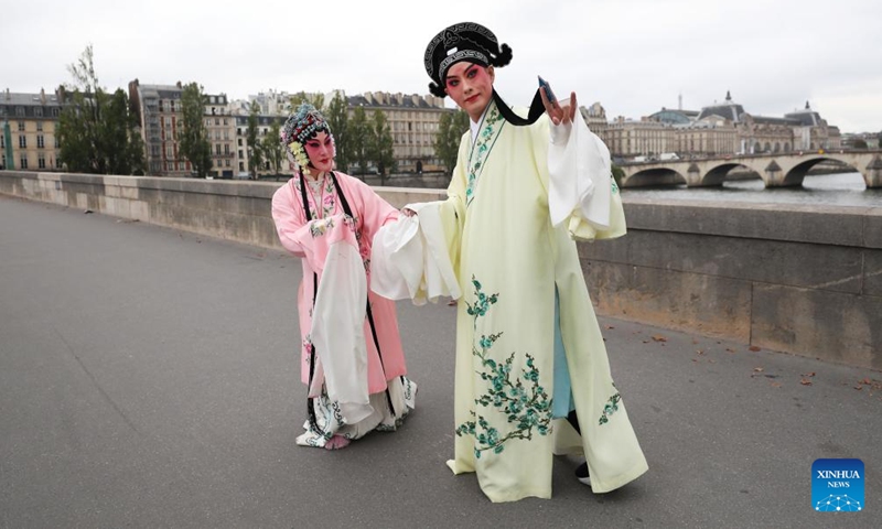 Kunqu Opera actor Shi Xiaming (R) and actress Kong Aiping stage a flash mob performance along the River Seine in Paris, France, Sept. 13, 2023. Artists from east China's Jiangsu Province presented the charm of Kunqu Opera through a series of flash mob performances near the iconic landmarks in Paris. (Photo: Xinhua)