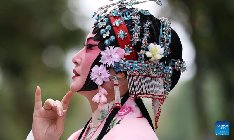 Kunqu Opera actress Kong Aiping is seen during a flash mob performance near the Eiffel Tower in Paris, France, Sept. 13, 2023. Artists from east China's Jiangsu Province presented the charm of Kunqu Opera through a series of flash mob performances near the iconic landmarks in Paris. (Photo: Xinhua)