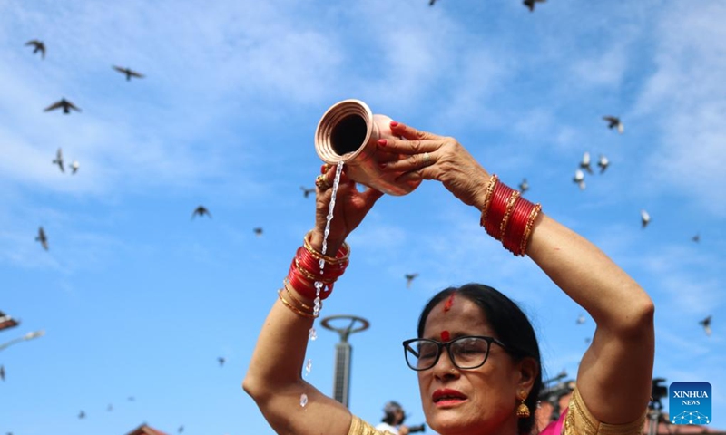 A woman offers prayers during the Teej Festival in Kathmandu, Nepal, Sept. 18, 2023.(Photo: Xinhua)