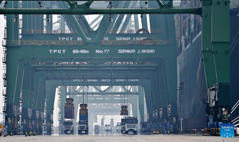 Vehicles transport containers in Tianjin Port in north China's Tianjin, Sept. 18, 2023. Since the beginning of this year, north China's Tianjin Port has seen nearly 500 China-Europe and China-Central Asia freight train trips. The freight train service is of great significance to further promote the coordinated development of the international logistics in the Beijing-Tianjin-Hebei region.(Photo: Xinhua)