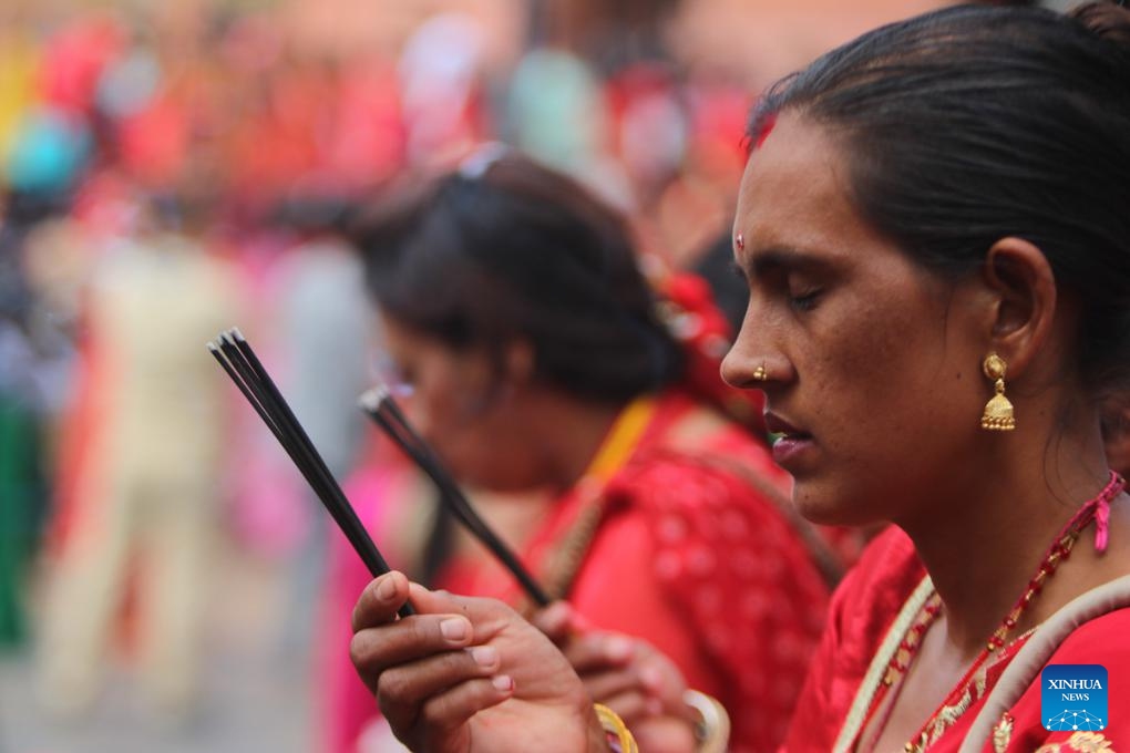Women offer prayers during the Teej Festival in Kathmandu, Nepal, Sept. 18, 2023.(Photo: Xinhua)