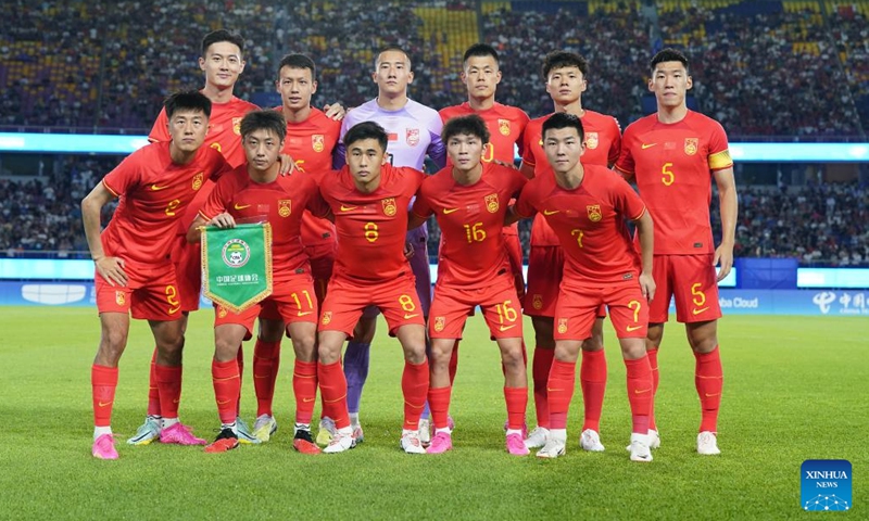 The line-up players of China pose for photos during the men's football group A first round match between China and India at the 19th Asian Games in Hangzhou, east China's Zhejiang Province, Sept. 19, 2023.(Photo: Xinhua)