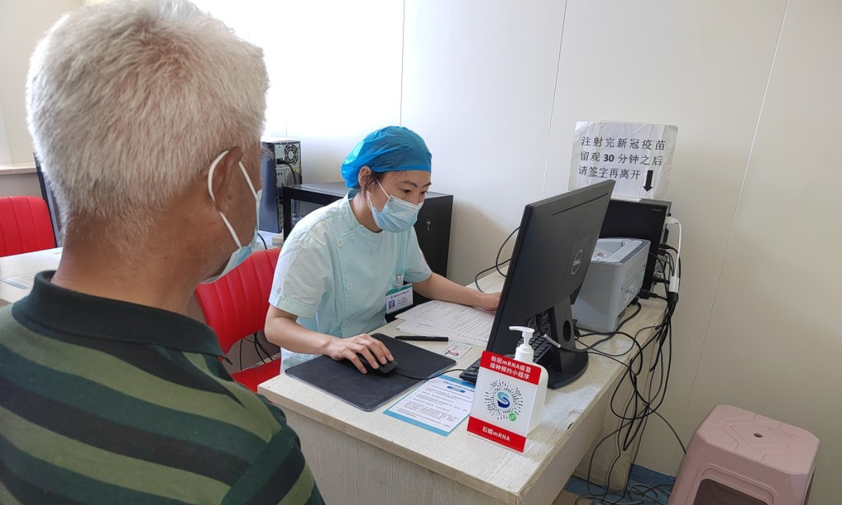 A man registers his information to get China's first domestic mRNA vaccine for COVID-19 in Shijiazhuang, North China's Hebei Province, where the vaccine was initially put into use on May 14, 2023. Photo: Hebei Daily