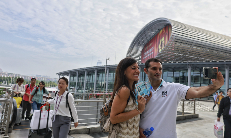 Foreign buyers take a selfie at the 134th session of Canton Fair on October 15, 2023, in Guangzhou, South China's Guangdong Province. Photo: Li Hao/GT