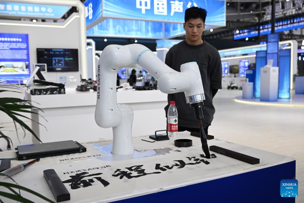 A robot writing calligraphy is displayed at the 2023 World Manufacturing Convention in Hefei, east China's Anhui Province, Sept. 20, 2023. The 2023 World Manufacturing Convention kicked off Wednesday in Hefei, built around the theme Intelligent manufacturing for a better future. With a record number of exhibitors, the five-day event features activities as exhibitions, summits and forums.(Photo: Xinhua)