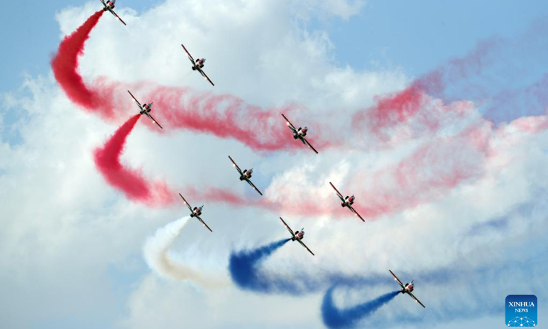 Aircraft perform aerobatics during the New Administrative Capital Air Show 2023 in the new administrative capital, east of Cairo, Egypt, Oct. 14, 2023. Aircraft from Egypt and Saudi Arabia jointly staged the New Administrative Capital Air Show 2023 in the new administrative capital on Saturday. (Xinhua/Ahmed Gomaa)