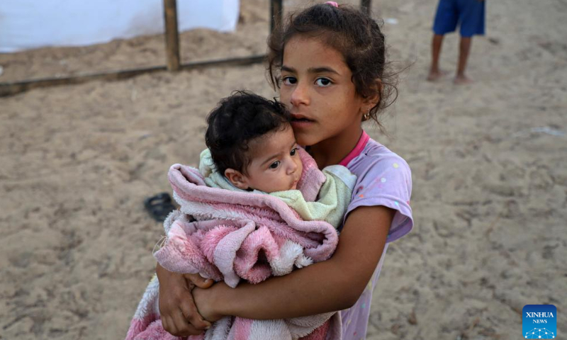 Displaced Palestinian children are seen in a temporary shelter in the southern Gaza Strip, October 25, 2023. Photo: Xinhua