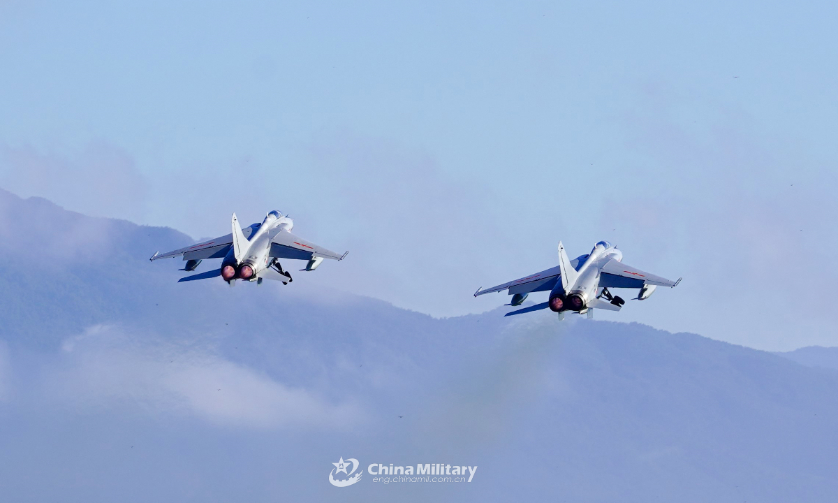 Fighter jets attached to an aviation brigade with the air force under the PLA Southern Theater Command take off in formation during a flight training exercise on September 20, 2023. The exercise aimed to enhance the troops' capabilities of emergency response, take-off and landing in unfamiliar airports, and long-distance maneuver. Photo:China Military