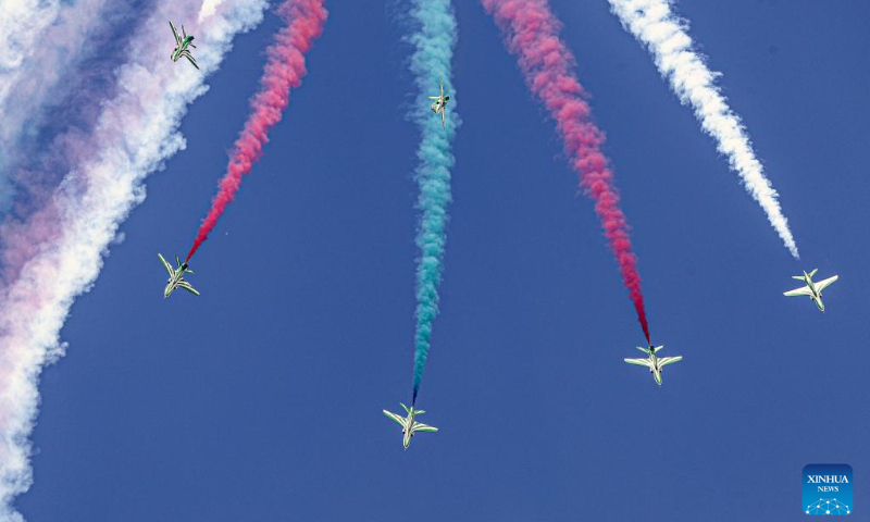 Aircraft perform aerobatics during the New Administrative Capital Air Show 2023 in the new administrative capital, east of Cairo, Egypt, Oct. 14, 2023. Aircraft from Egypt and Saudi Arabia jointly staged the New Administrative Capital Air Show 2023 in the new administrative capital on Saturday. (Xinhua/Ahmed Gomaa)