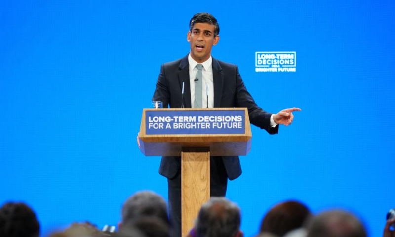 British Prime Minister Rishi Sunak delivers a keynote speech at the Conservative Party's annual conference in Manchester, Britain, on Oct. 4, 2023. United Kingdom (UK) Prime Minister Rishi Sunak vowed on Wednesday to build a brighter future for the country as he scrapped the northern leg of the flagship HS2 rail project and introduced a raft of new measures to shore up support for the ruling Conservative Party as the next general election nears. (Xinhua)