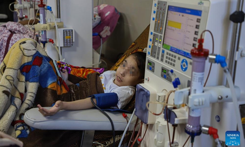 A young Palestinian patient receives treatment at the dialysis department of a hospital in Gaza City, Sept. 20, 2023. At least 1,100 Palestinian kidney patients are facing an interruption of life-saving treatment due to a lack of medicines and medical equipment in the coastal enclave, the Hamas-run Health Ministry said on Wednesday.(Photo: Xinhua)