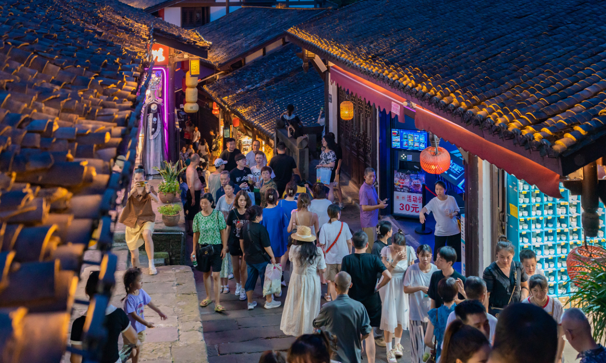 Tourists visit Ciqikou ancient town in Southwest China's Chongqing Municipality on August 11, 2023. Photo: CFP