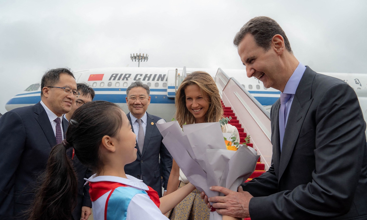 A handout picture released by the official Syrian Arab News Agency shows Syrian President Bashar al-Assad and First Lady Asma al-Assad being welcomed upon their arrival at the airport in Hangzhou, capital city of ?East China's Zhejiang Province, on September 21, 2023. Bashar arrived in the scenic city to attend the opening ceremony of the 19th Asian Games to be held on September 23.?Photo: VCG