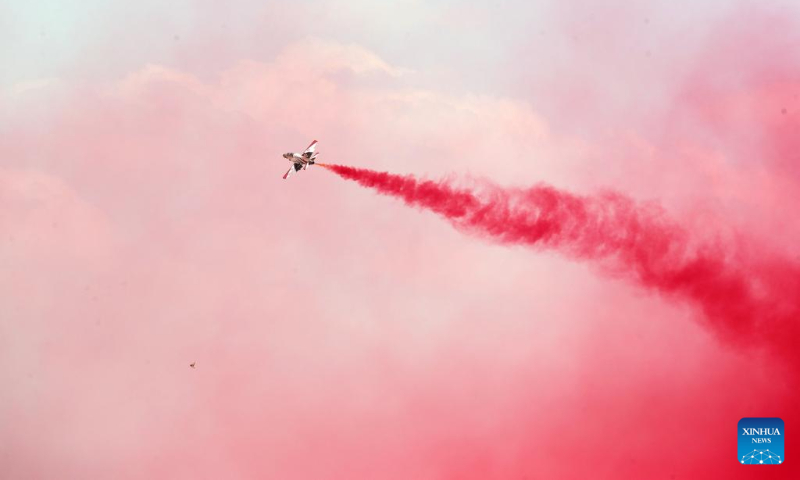 An aircraft performs aerobatics during the New Administrative Capital Air Show 2023 in the new administrative capital, east of Cairo, Egypt, Oct. 14, 2023. Aircraft from Egypt and Saudi Arabia jointly staged the New Administrative Capital Air Show 2023 in the new administrative capital on Saturday. (Xinhua/Ahmed Gomaa)