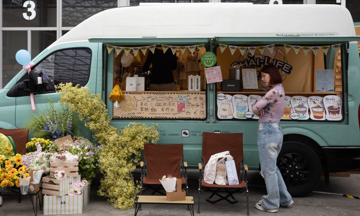 A woman attends a coffee festival at Langyuan Station in Beijing. Photo: IC