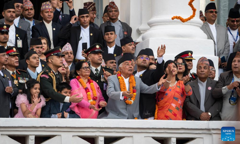 Nepal's President Ram Chandra Poudel observes the chariot procession of the Indra Jatra festival in Kathmandu, Nepal, Sept. 28, 2023. (Photo by Hari Maharjan/Xinhua)