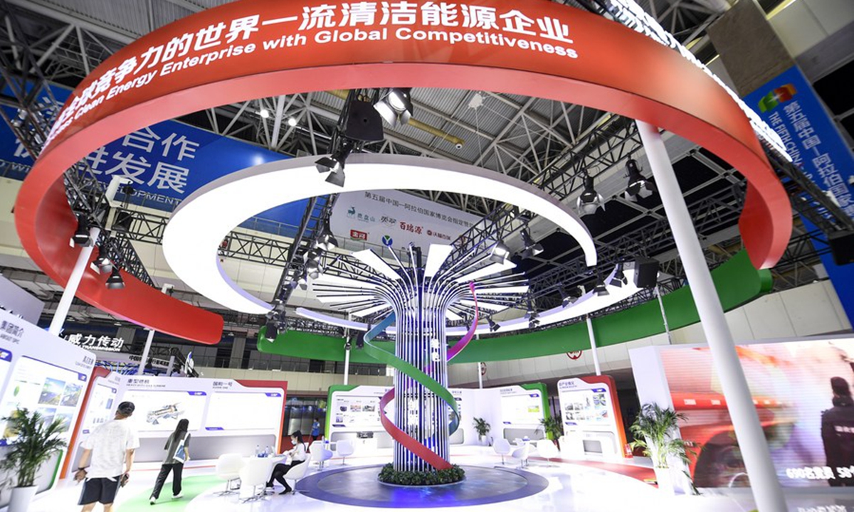 People visit the clean energy and new materials exhibition area at the fifth China-Arab States Expo in Yinchuan, northwest China's Ningxia Hui Autonomous Region, Aug. 22, 2021. (Xinhua/Feng Kaihua)

