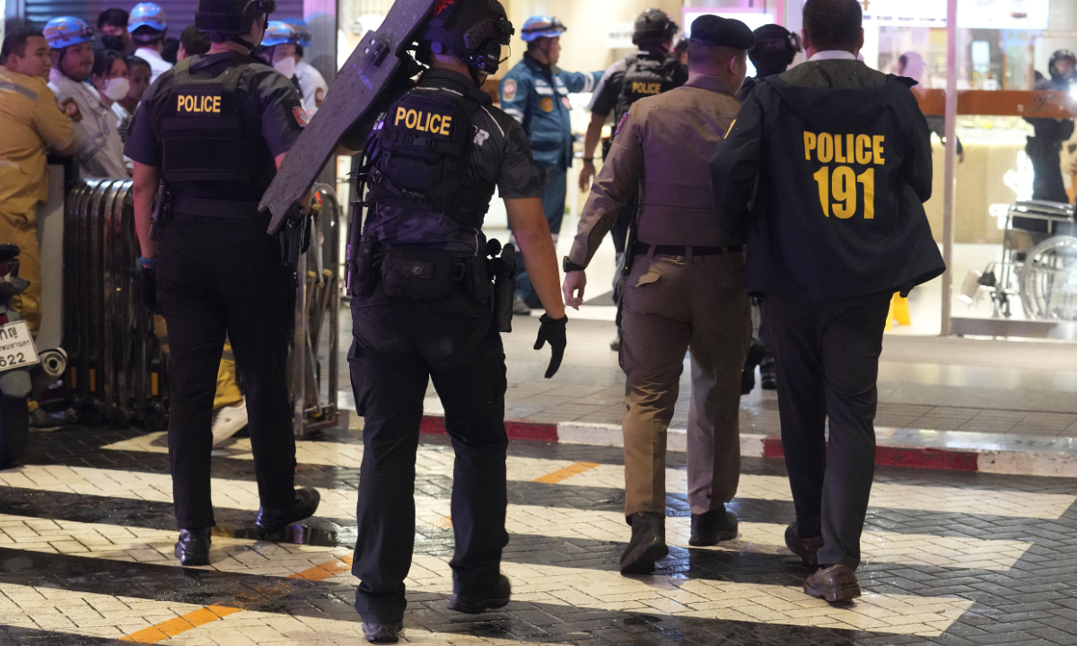 Local police arrive at a shopping mall in Bangkok, Thailand, Tuesday, Oct. 3, 2023.